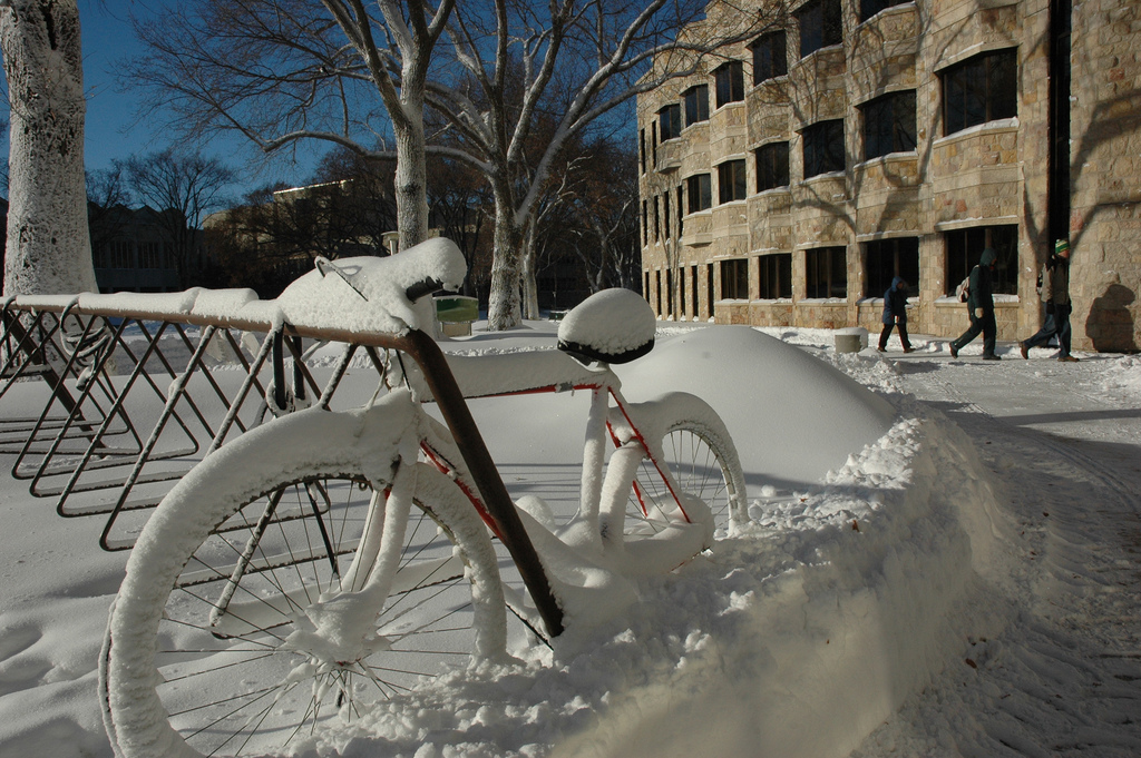 A bike covered in snow at the U of S campus